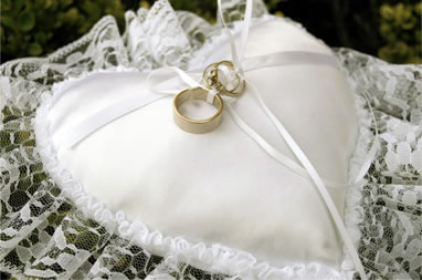 Wedding pillow with rings on top